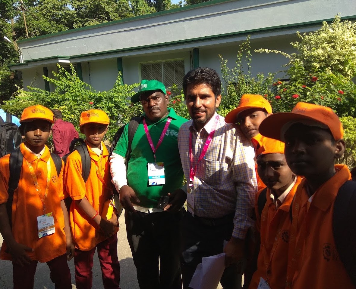 Kripal Singh with participants in a science outreach programme